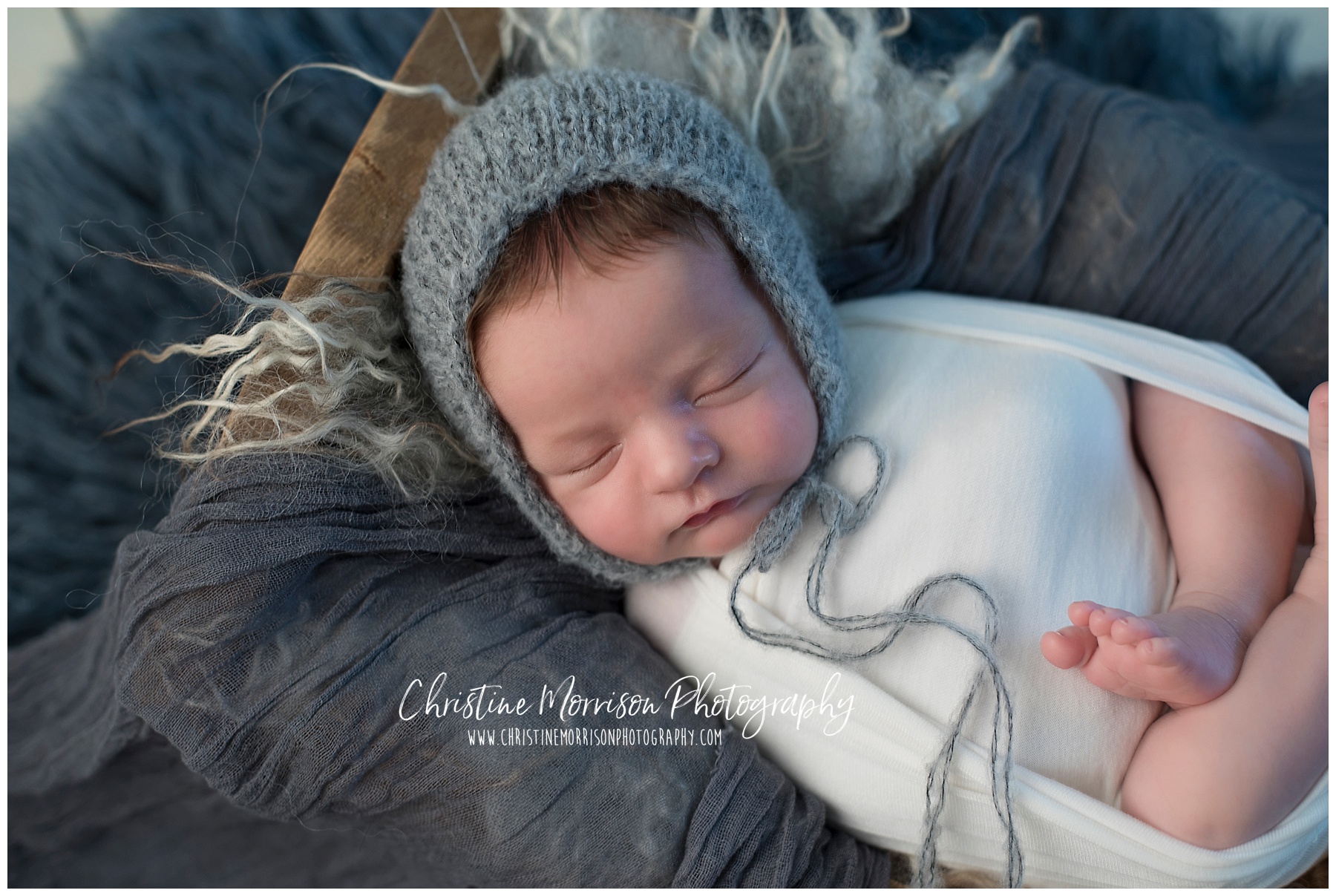 Baby boy in white and grey newborn session