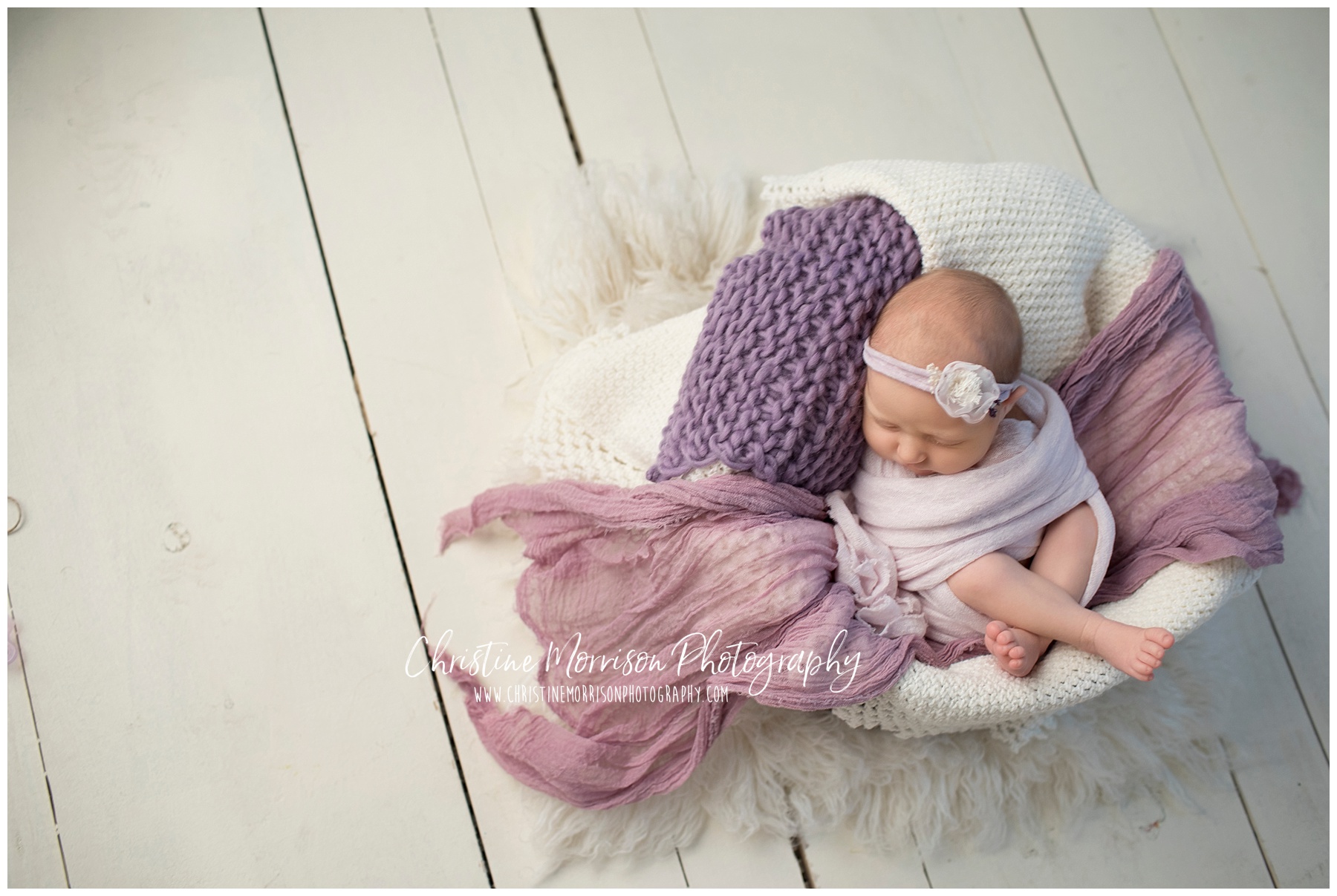 Sweet baby girl in purple and moms baby blanket
